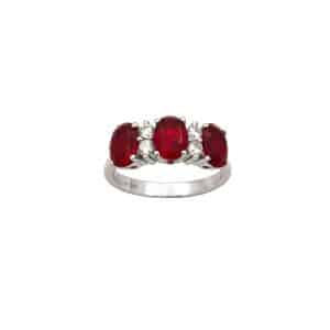Anillo plata engastado en tresillo de circonitas blancas y rubí